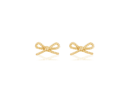 Gold bow-shaped earrings on a white background