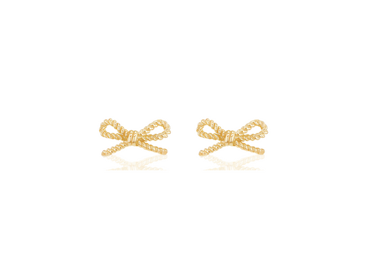 Gold bow-shaped earrings on a white background