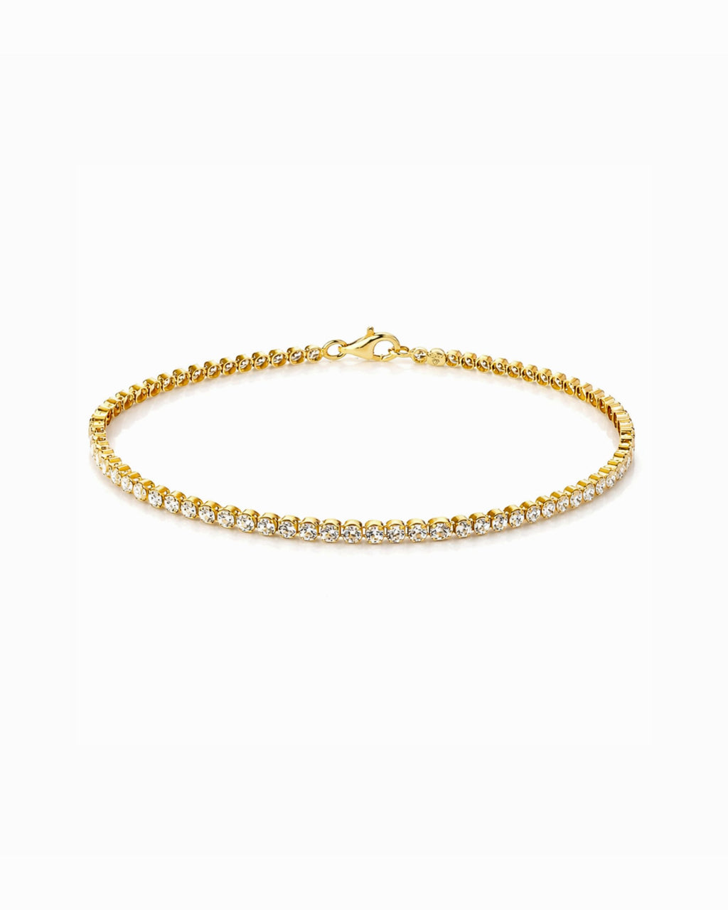 Gold bracelet with Cubic Zirconia stones on a white background