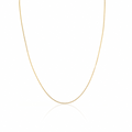 A delicate gold curb chain necklace displayed in a U-shape against a clean white background with a subtle reflection below.