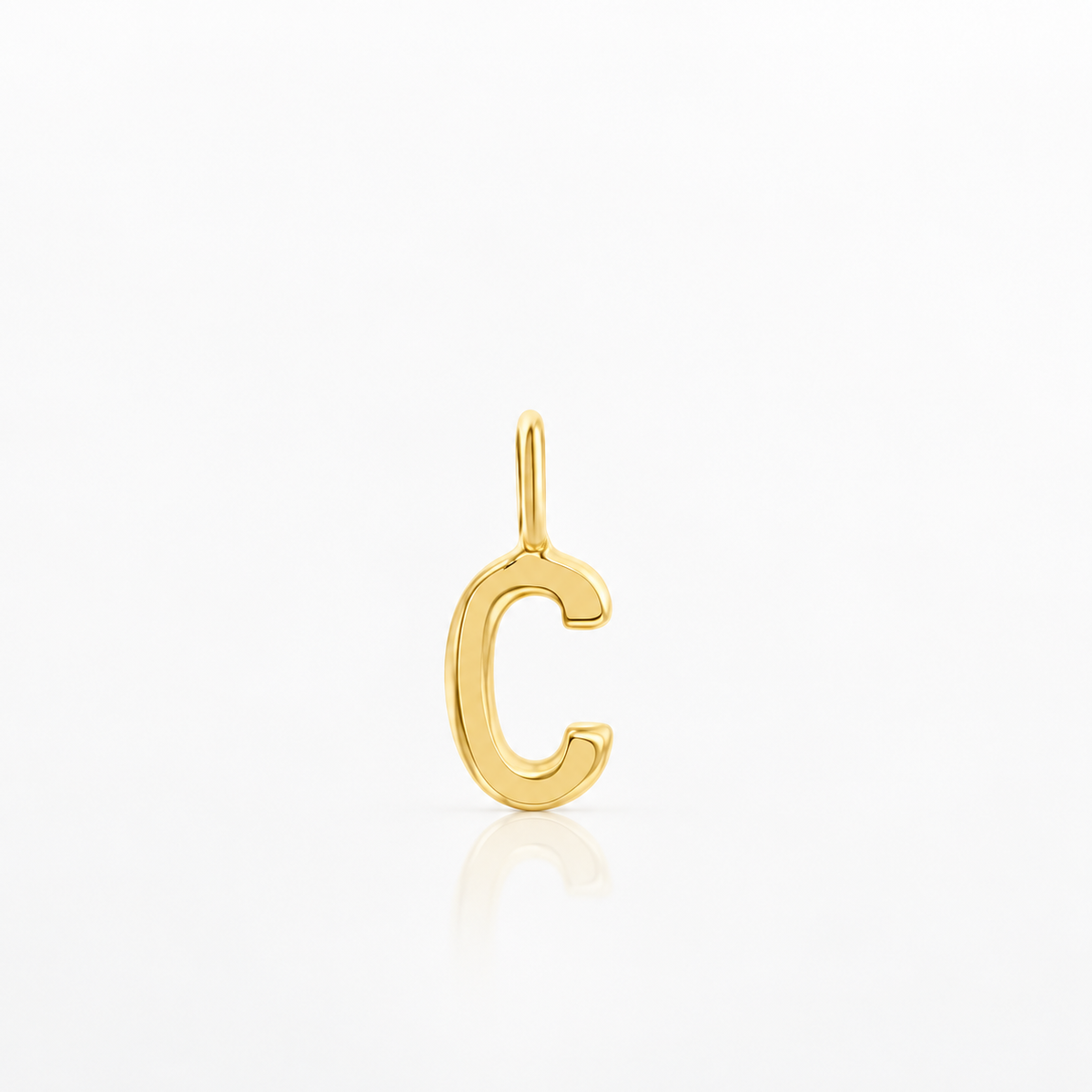 A polished gold letter 'C' initial pendant charm with a hanging loop, shown on a clean white background with a soft reflection below.