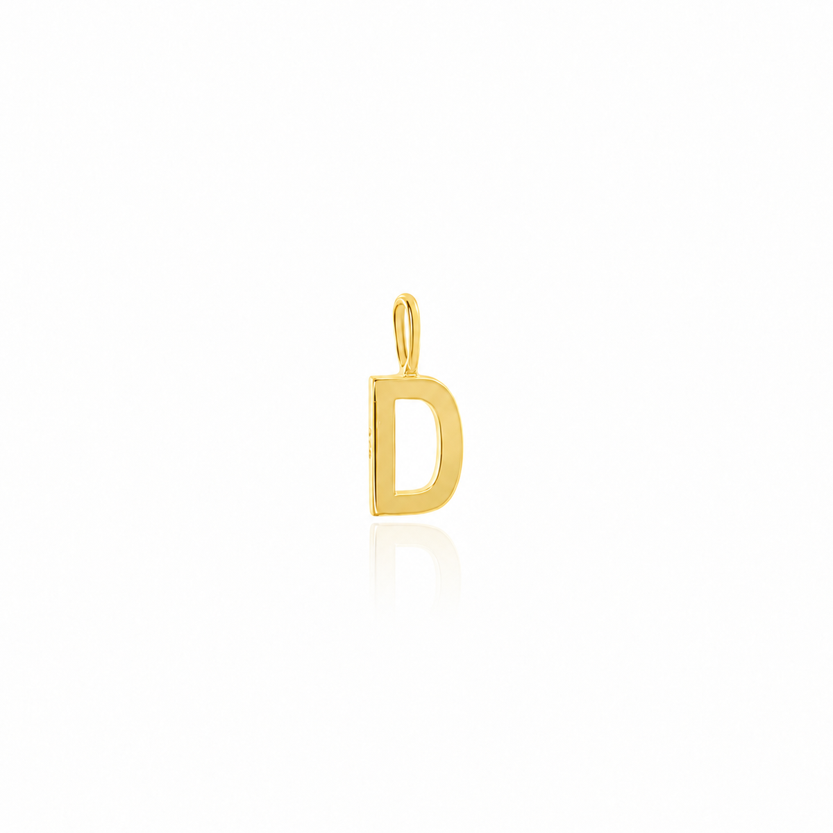 A polished yellow gold initial pendant charm shaped like the letter 'D' with a hanging loop, centered on a clean white background with a soft reflection below.