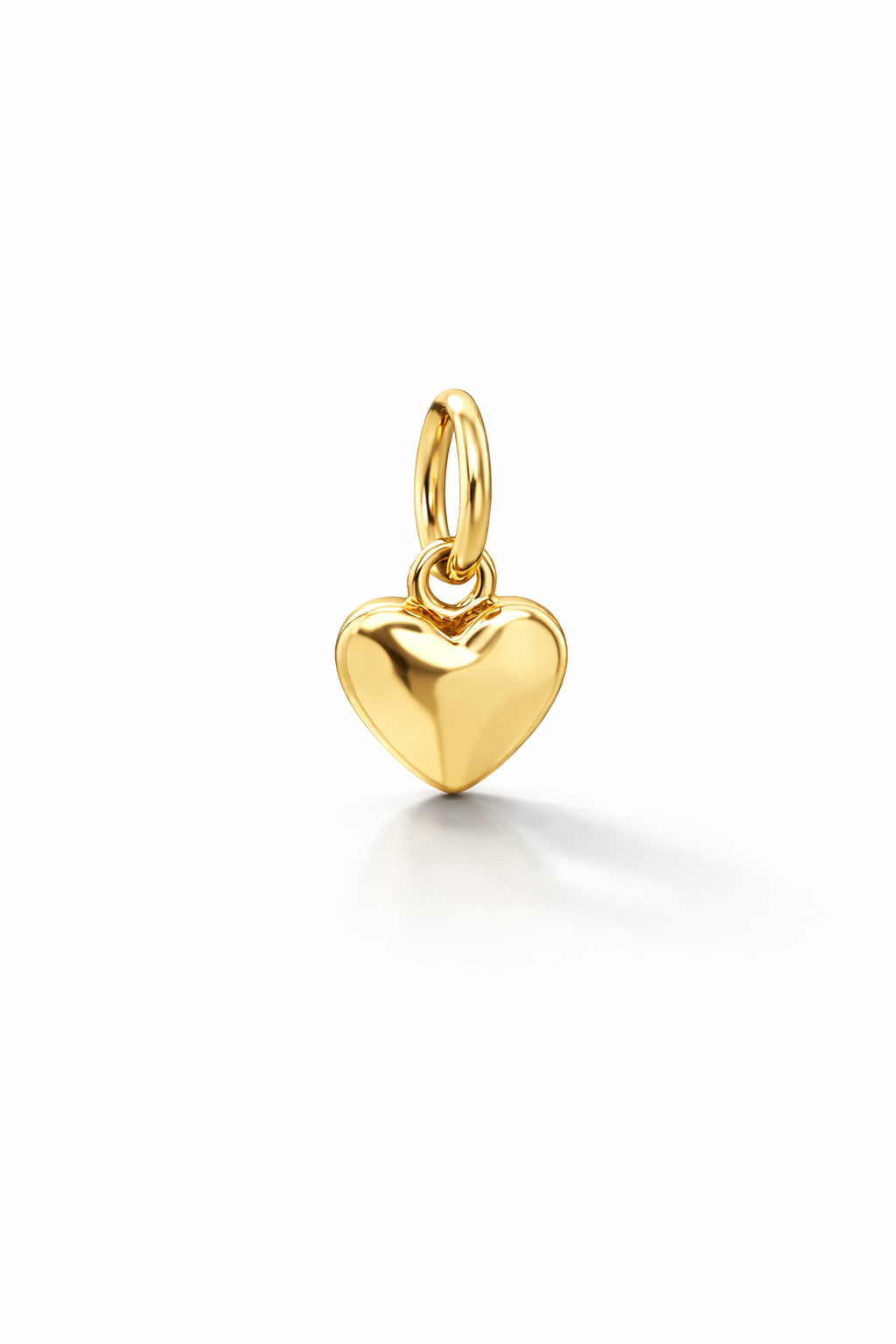 Gold heart-shaped pendant on a white background