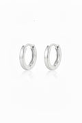Pair of polished 12mm sterling silver hinged hoop earrings with a soft reflection on a white background