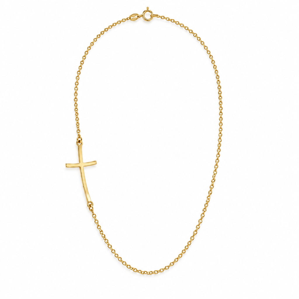 9ct yellow gold necklace with a gently curved sideways cross on a fine cable chain, arranged in an oval on a white background with a soft shadow.