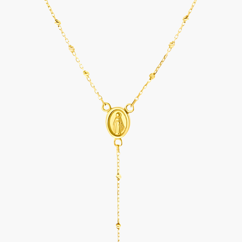 Close-up of diamond-cut beads, Madonna centre and cross drop — 9ct gold