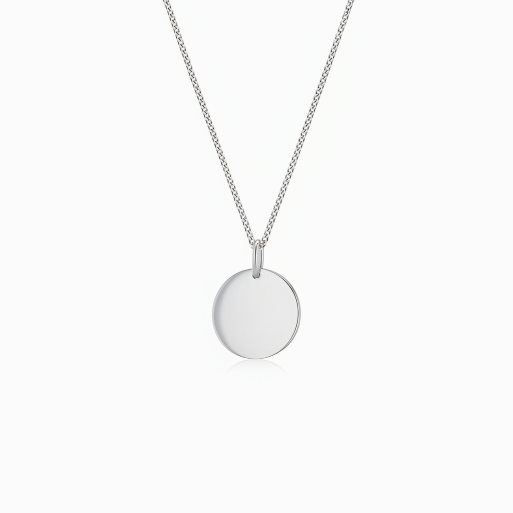 Silver necklace with a round pendant on a white background