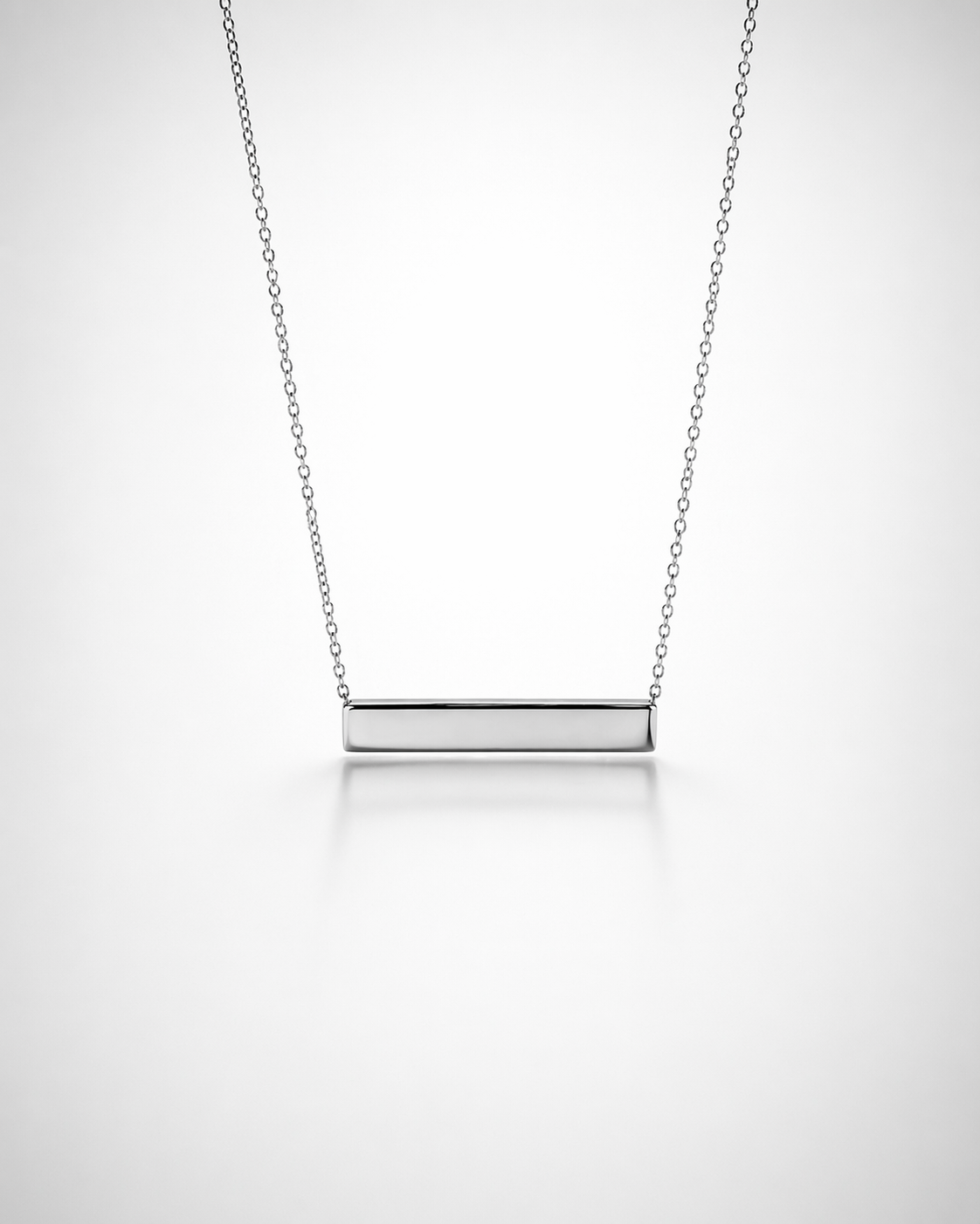 Silver bar necklace on a light gray background
