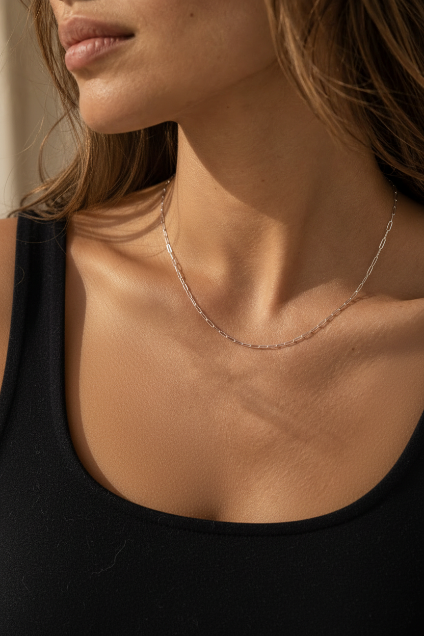 Model wearing a fine sterling silver paperclip chain necklace