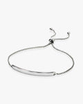 Silver adjustable bracelet on a white background