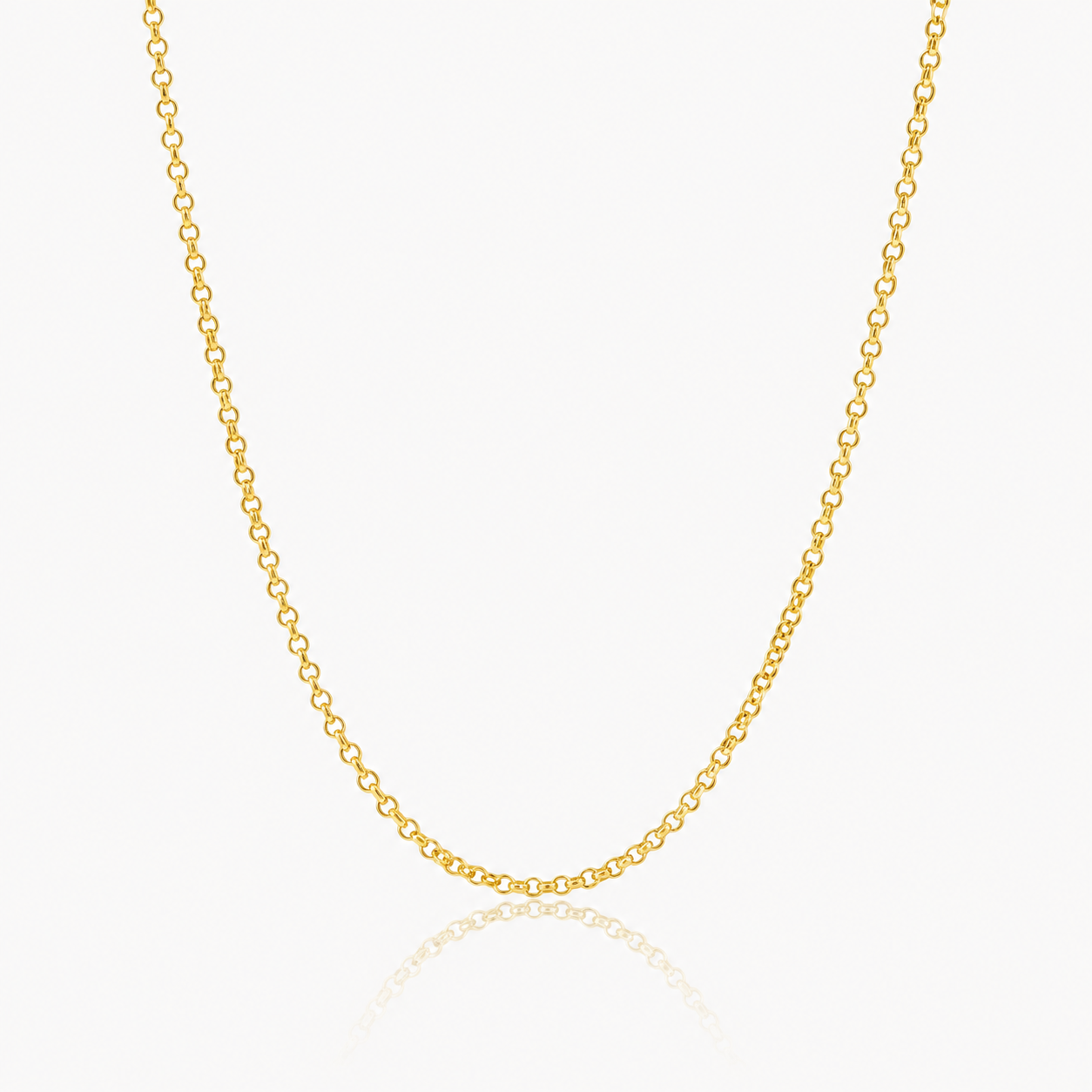 A delicate yellow gold chain necklace with small, evenly spaced oval links, displayed in a U-shape against a clean white background with a subtle reflection below.