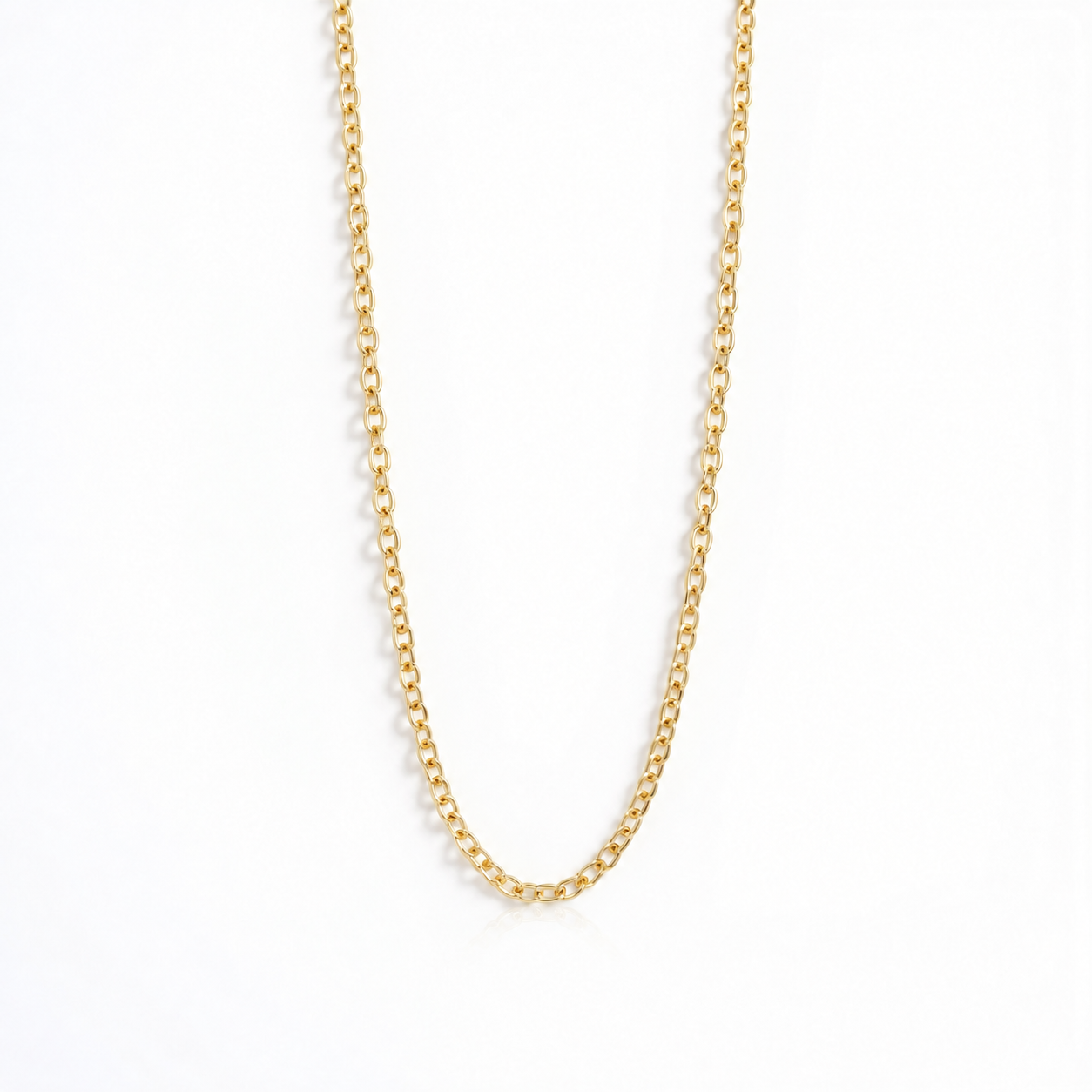A delicate gold chain necklace with a classic curb link design, displayed against a clean white background.