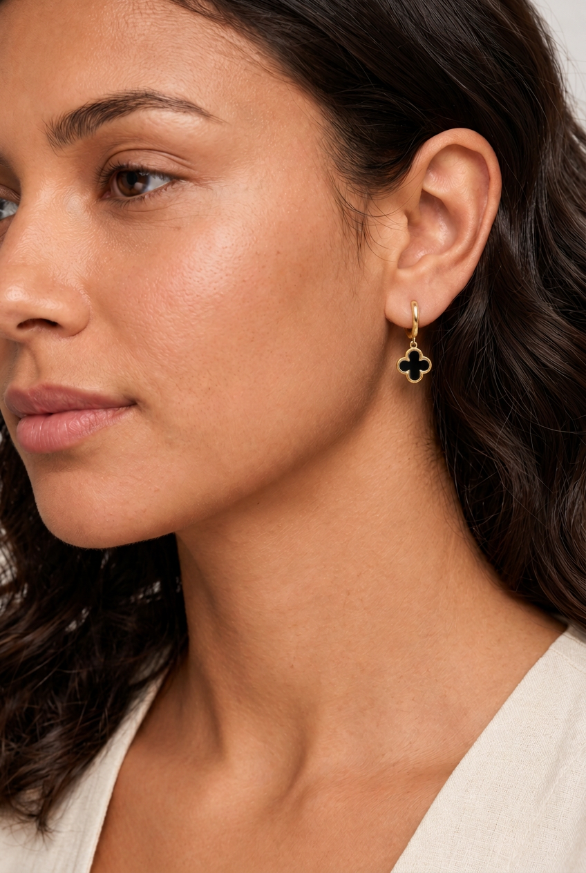 Refined RubyJade model image with petite black onyx clover huggie