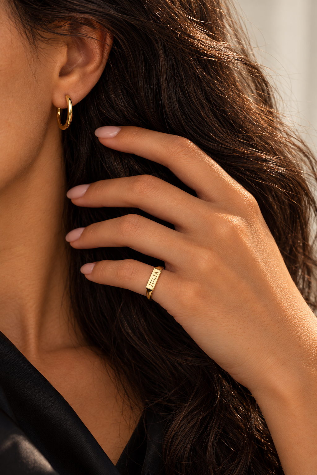 JULIA engraved yellow gold signet ring worn on the little finger, styled with a gold hoop earring